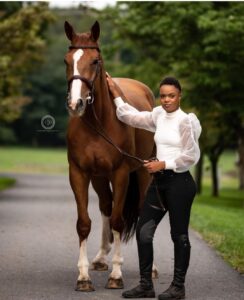 beautiful model with gorgeous chestnut horse with blaze